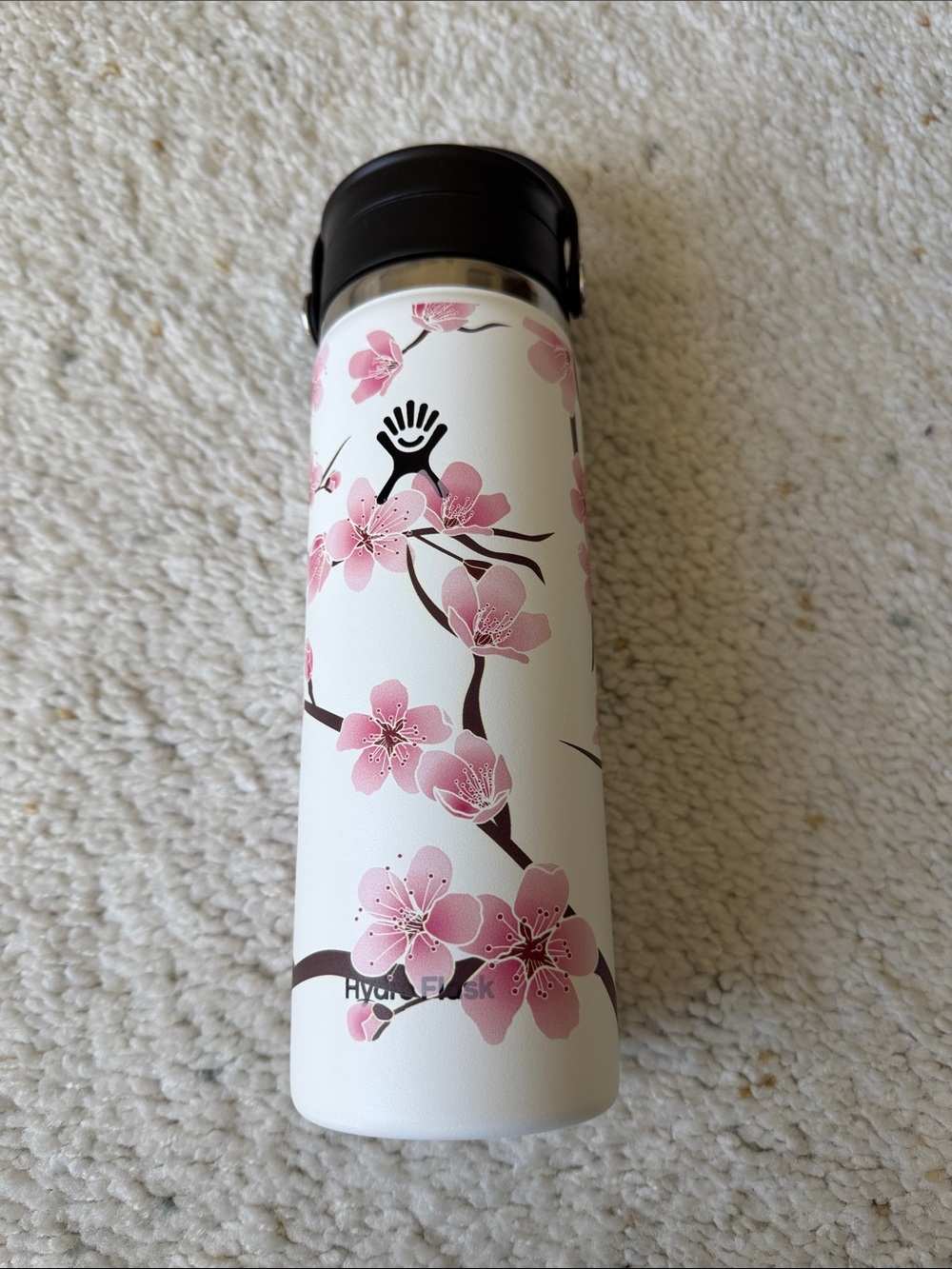Hydro Flask White Bottle with Pink Cherry Blossom Design and Black Lid